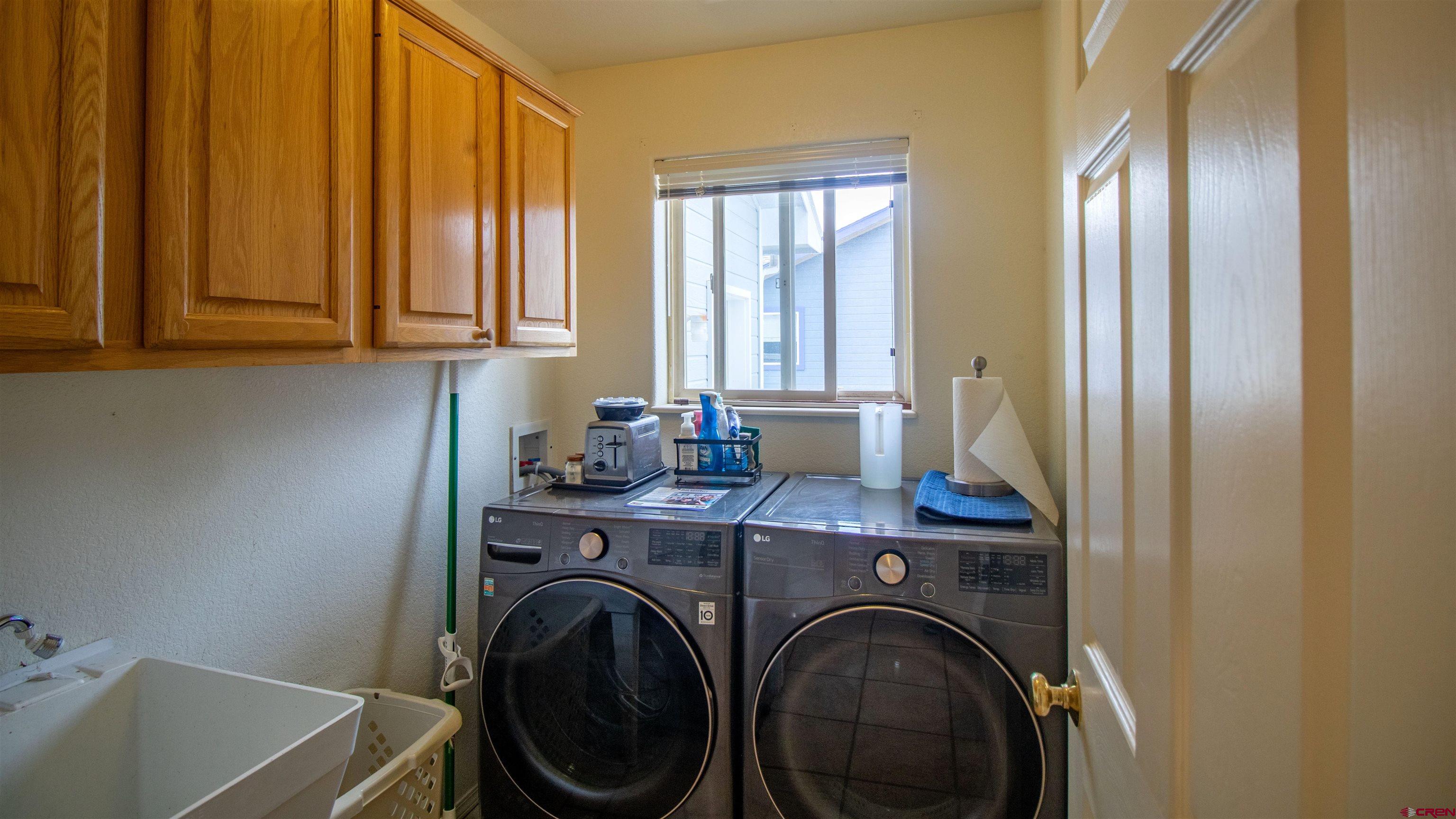 609 Heather Lane Montrose, CO 81401 - Photo 18 of 34 a view of a utility room with washer and dryer