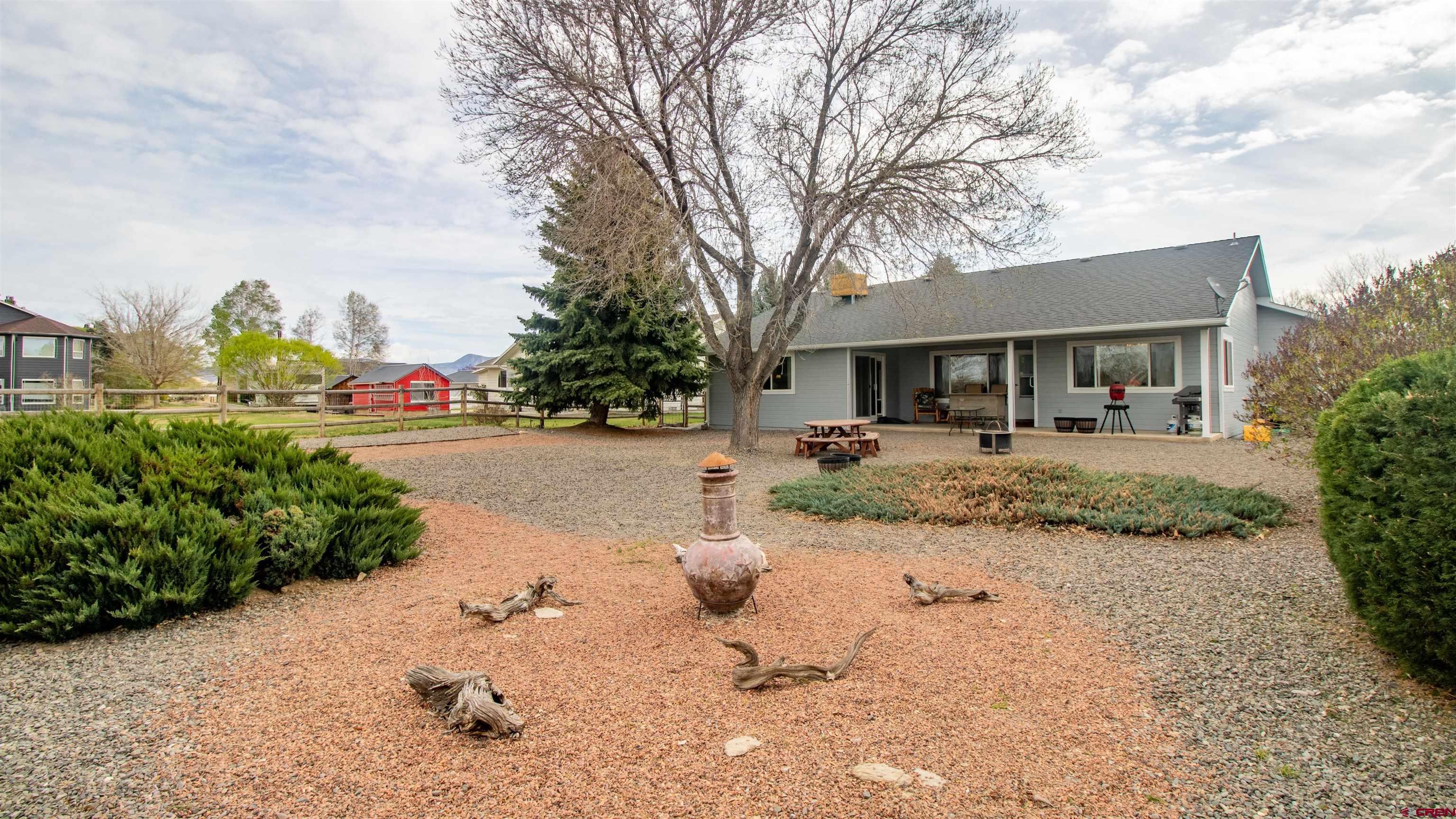 609 Heather Lane Montrose, CO 81401 - Photo 30 of 34 a front view of a house with garden