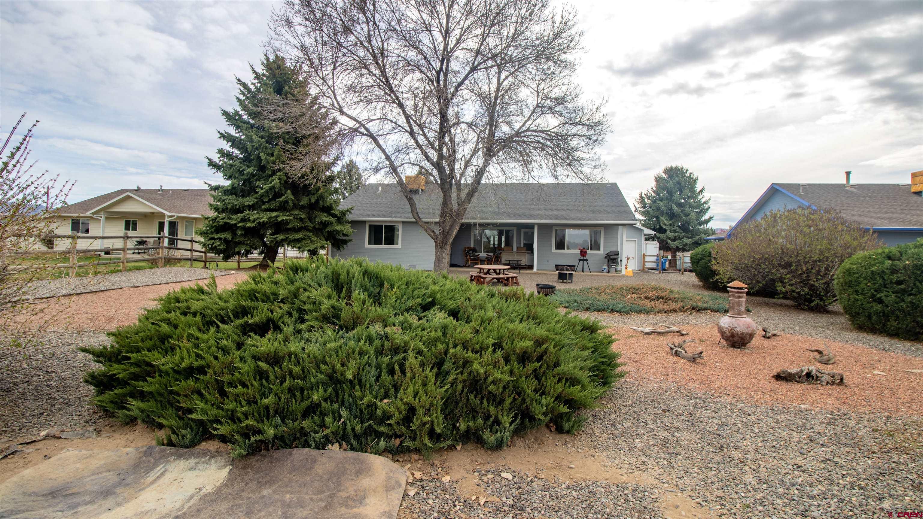 609 Heather Lane Montrose, CO 81401 - Photo 31 of 34 a front view of a house with a yard