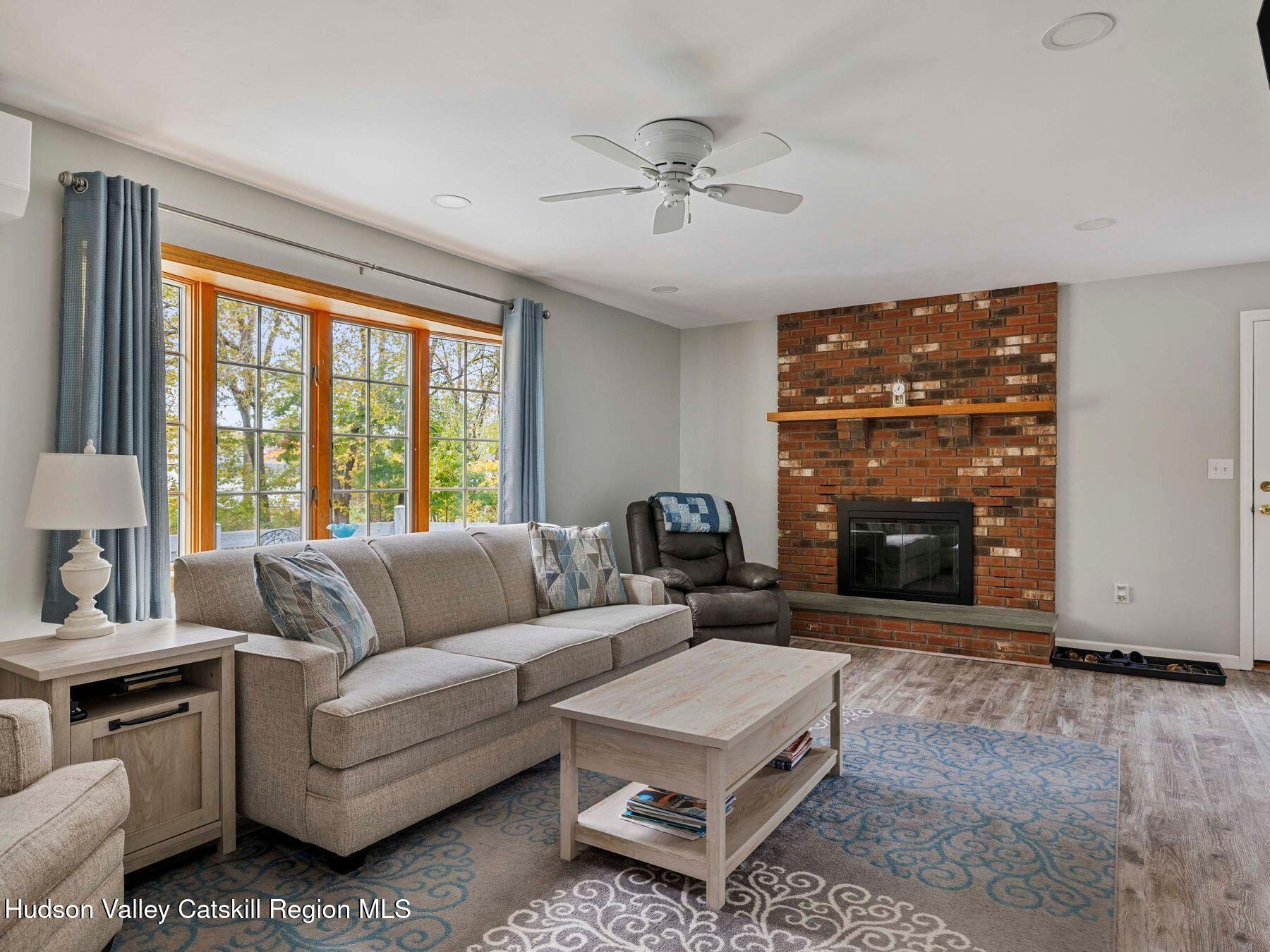 15 Ruby Meadows Road Lake Katrine, NY 12449 - Photo 14 of 53 a living room with furniture and a fireplace
