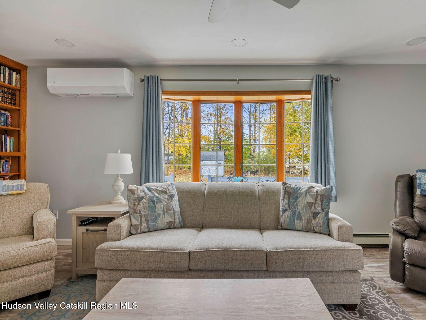 15 Ruby Meadows Road Lake Katrine, NY 12449 - Photo 15 of 53 a living room with furniture and a large window
