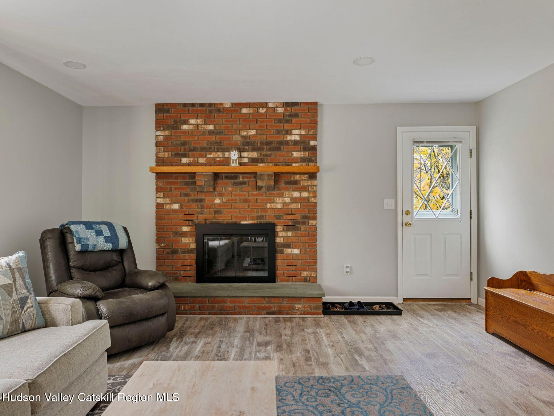 15 Ruby Meadows Road Lake Katrine, NY 12449 - Photo 16 of 53 a living room with furniture and a fireplace