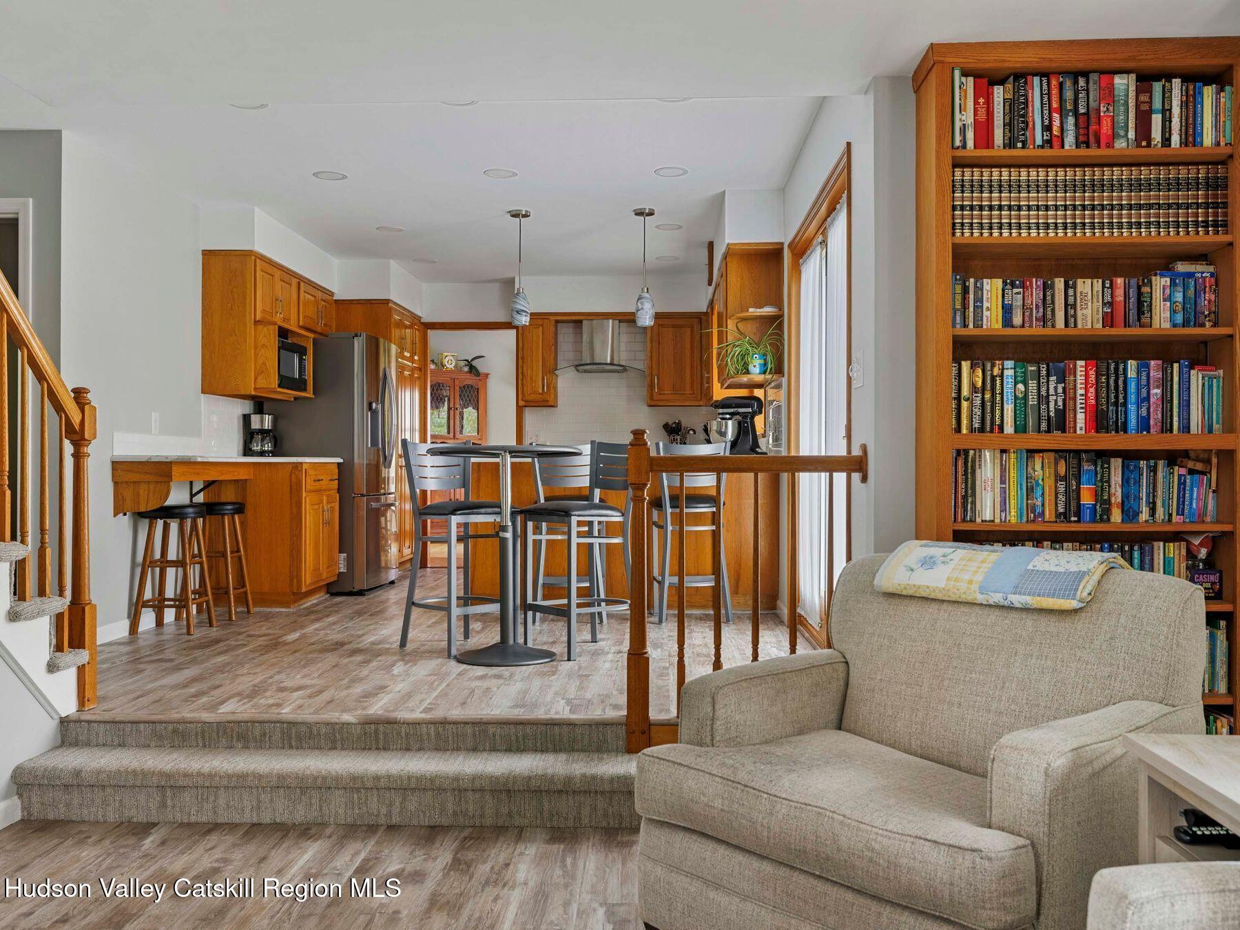 15 Ruby Meadows Road Lake Katrine, NY 12449 - Photo 18 of 53 a living room with lots of furniture and a book shelf