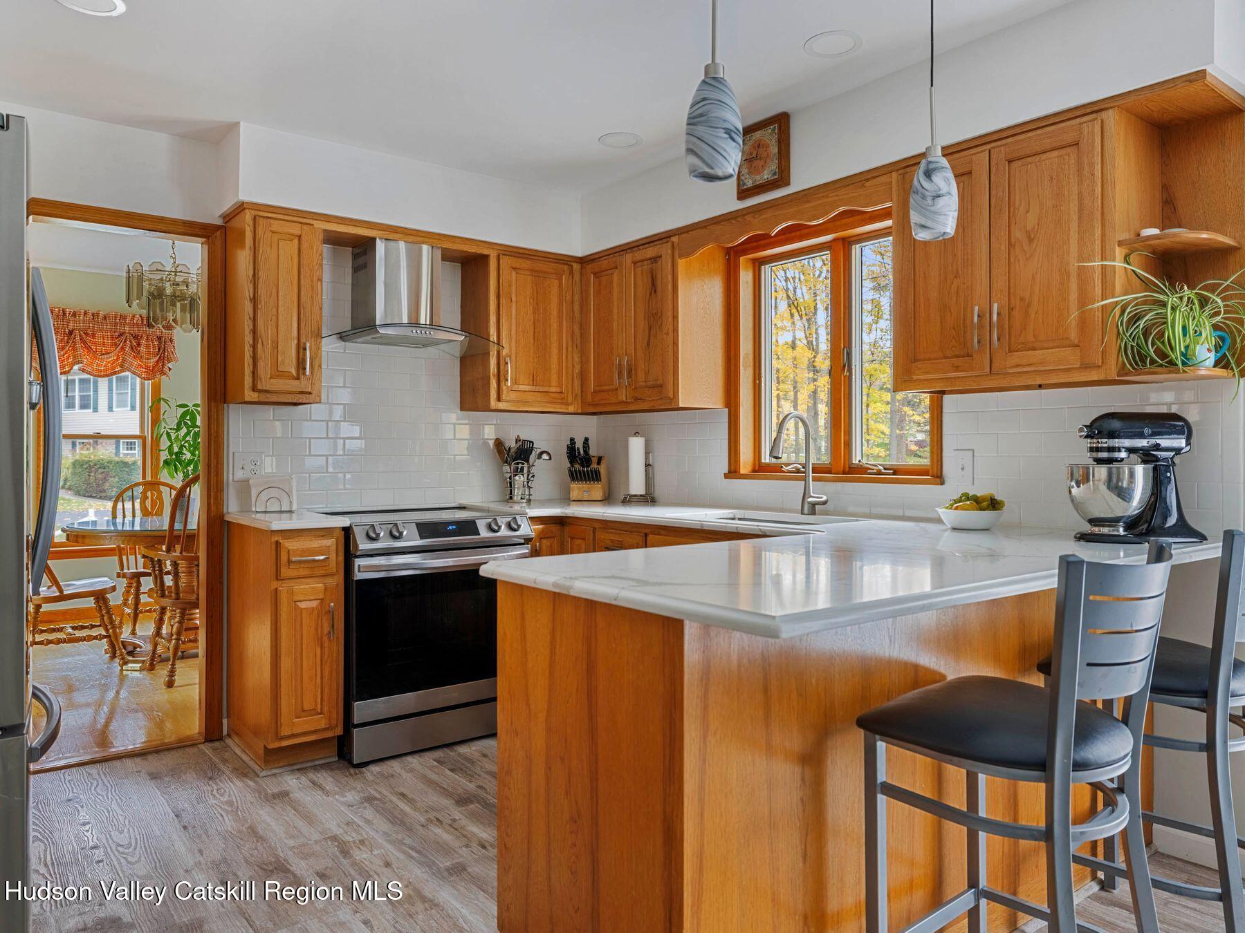 15 Ruby Meadows Road Lake Katrine, NY 12449 - Photo 20 of 53 a kitchen with stainless steel appliances granite countertop sink stove top oven and cabinets