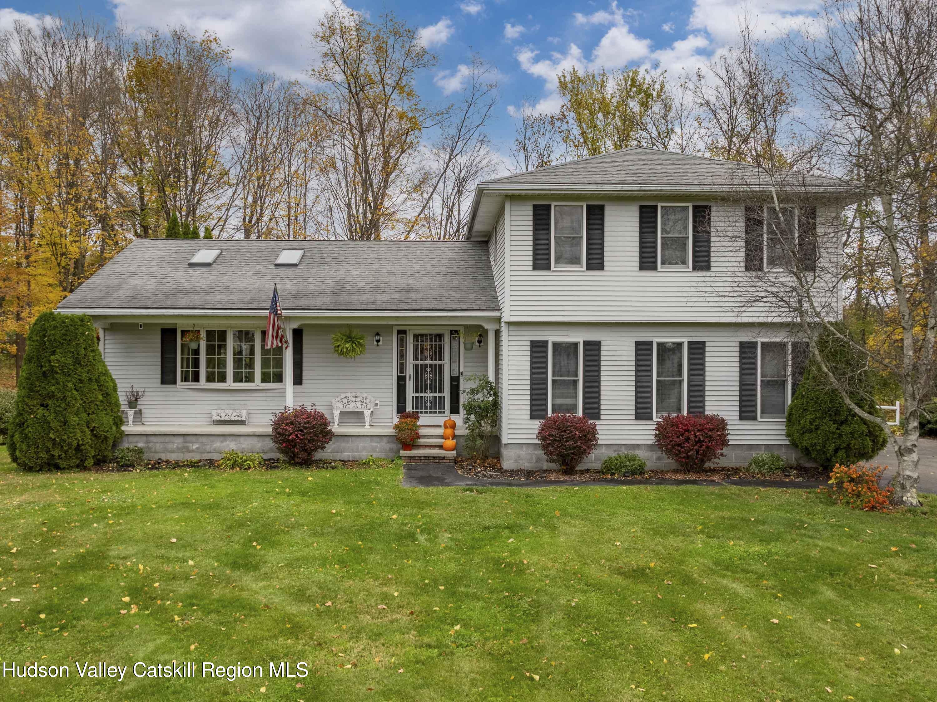 15 Ruby Meadows Road Lake Katrine, NY 12449 - Photo 2 of 53 a front view of a house with a garden and porch