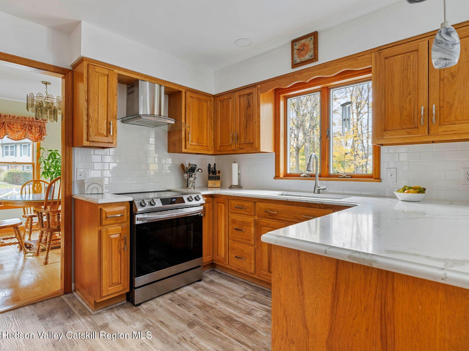 15 Ruby Meadows Road Lake Katrine, NY 12449 - Photo 22 of 53 a kitchen with stainless steel appliances granite countertop a sink stove and refrigerator