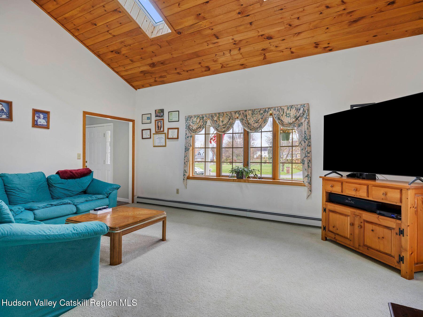 15 Ruby Meadows Road Lake Katrine, NY 12449 - Photo 28 of 53 a living room with furniture and a flat screen tv