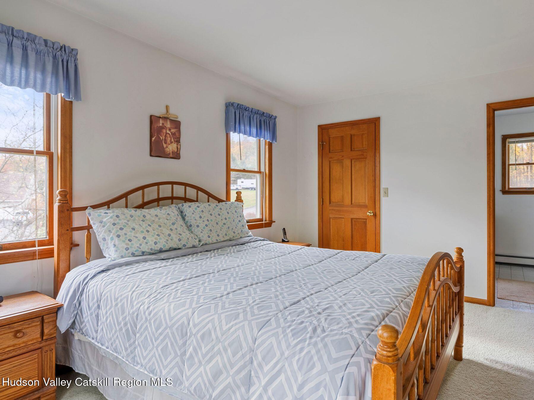 15 Ruby Meadows Road Lake Katrine, NY 12449 - Photo 34 of 53 a bedroom with a bed and a large window