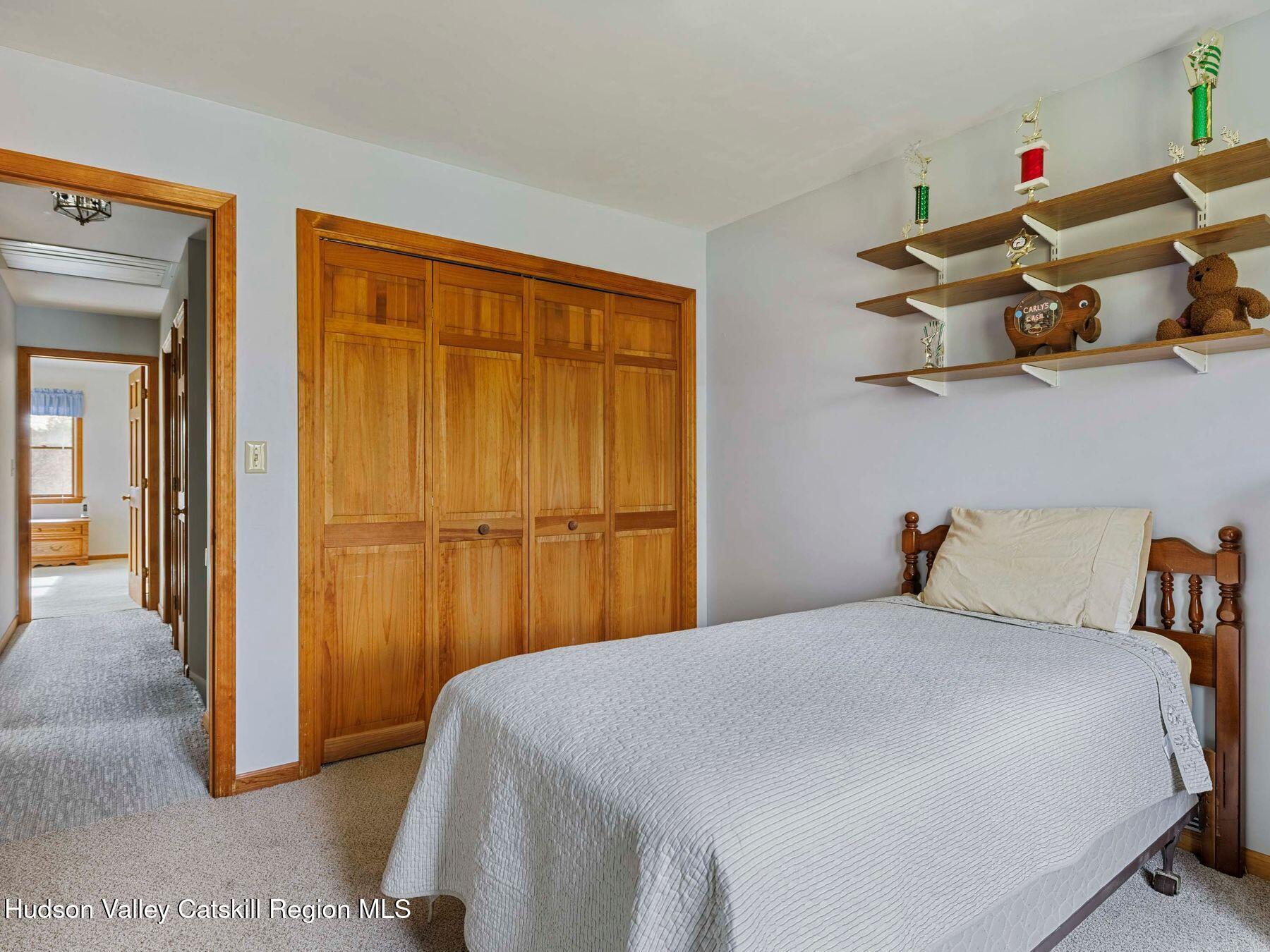 15 Ruby Meadows Road Lake Katrine, NY 12449 - Photo 36 of 53 a bedroom with a bed and a window