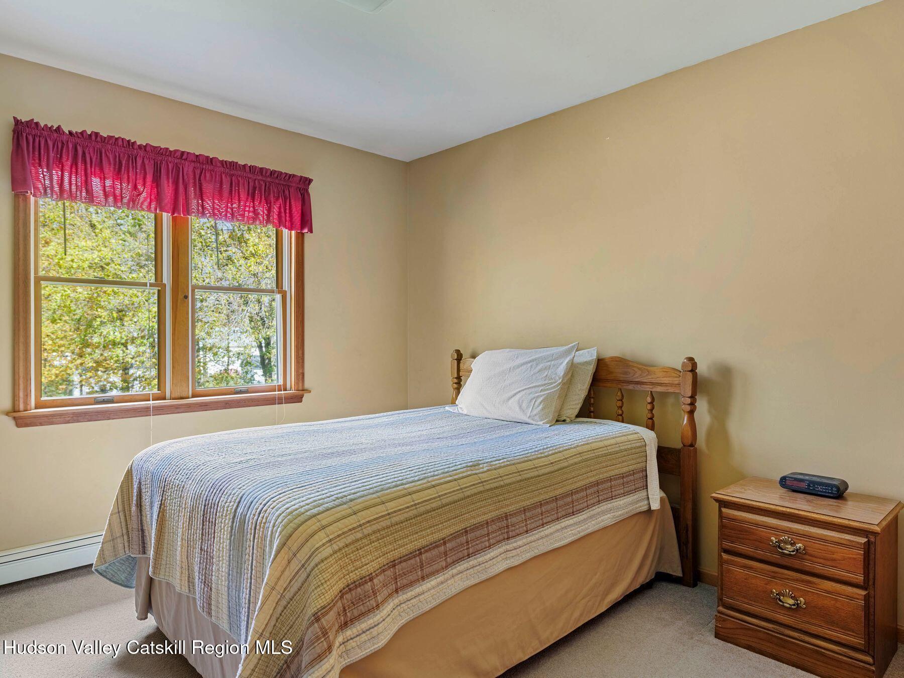 15 Ruby Meadows Road Lake Katrine, NY 12449 - Photo 37 of 53 a bedroom with a bed and a window