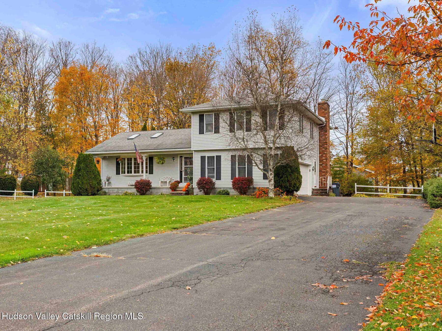 15 Ruby Meadows Road Lake Katrine, NY 12449 - Photo 4 of 53 a front view of a house with a yard and trees