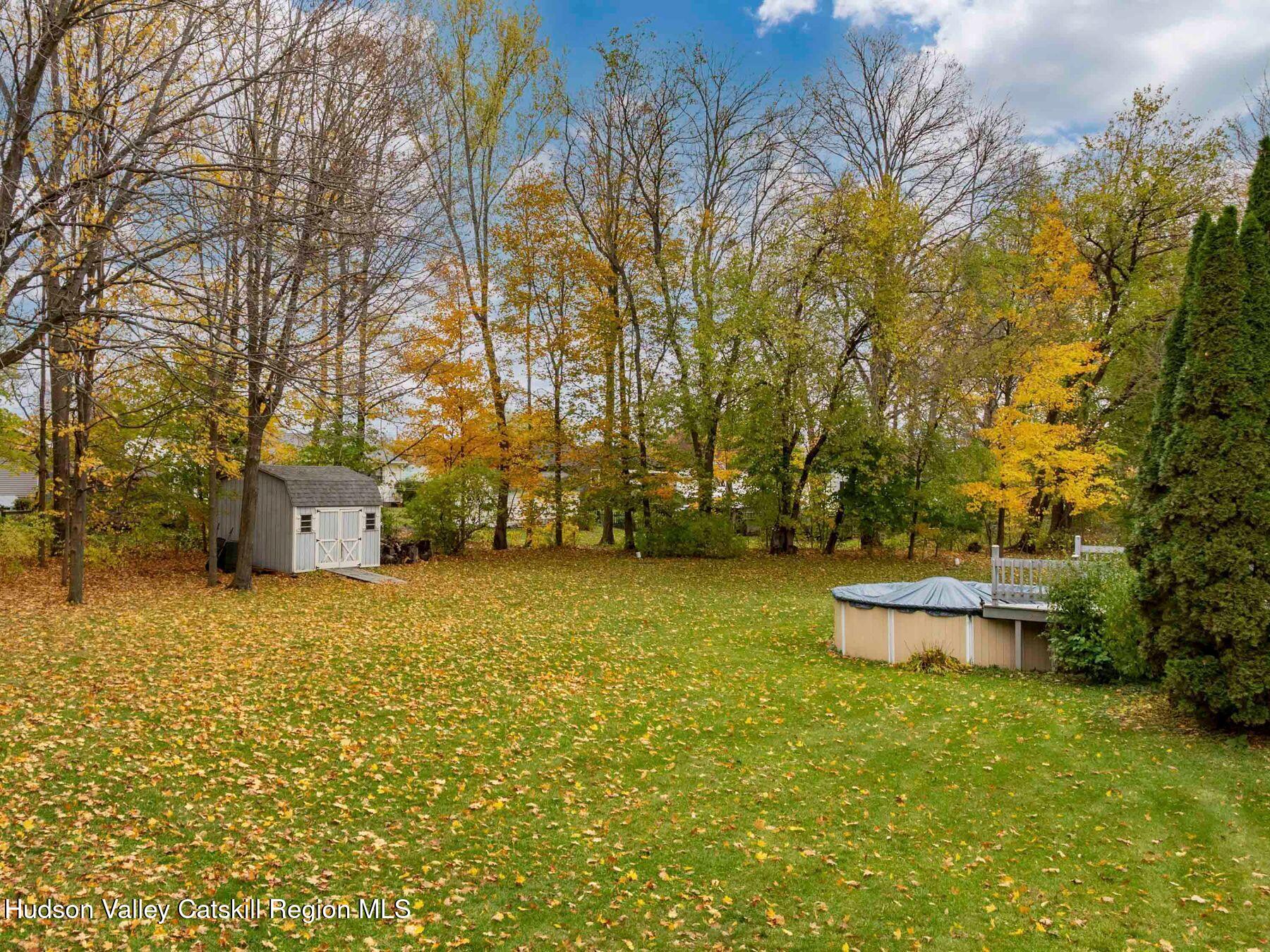 15 Ruby Meadows Road Lake Katrine, NY 12449 - Photo 41 of 53 a backyard of a house with a yard and fountain