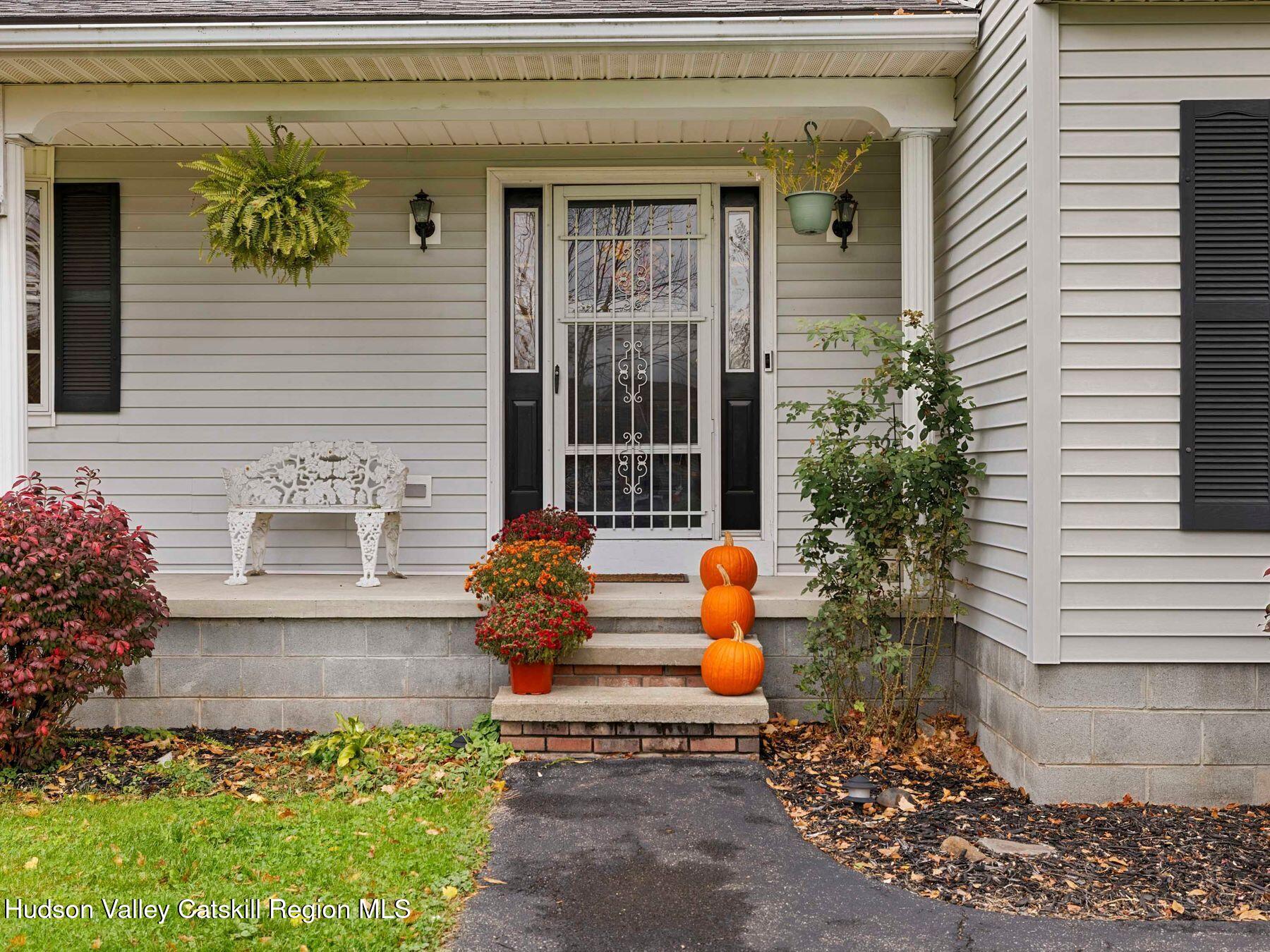 15 Ruby Meadows Road Lake Katrine, NY 12449 - Photo 46 of 53 a front view of a house with outdoor seating