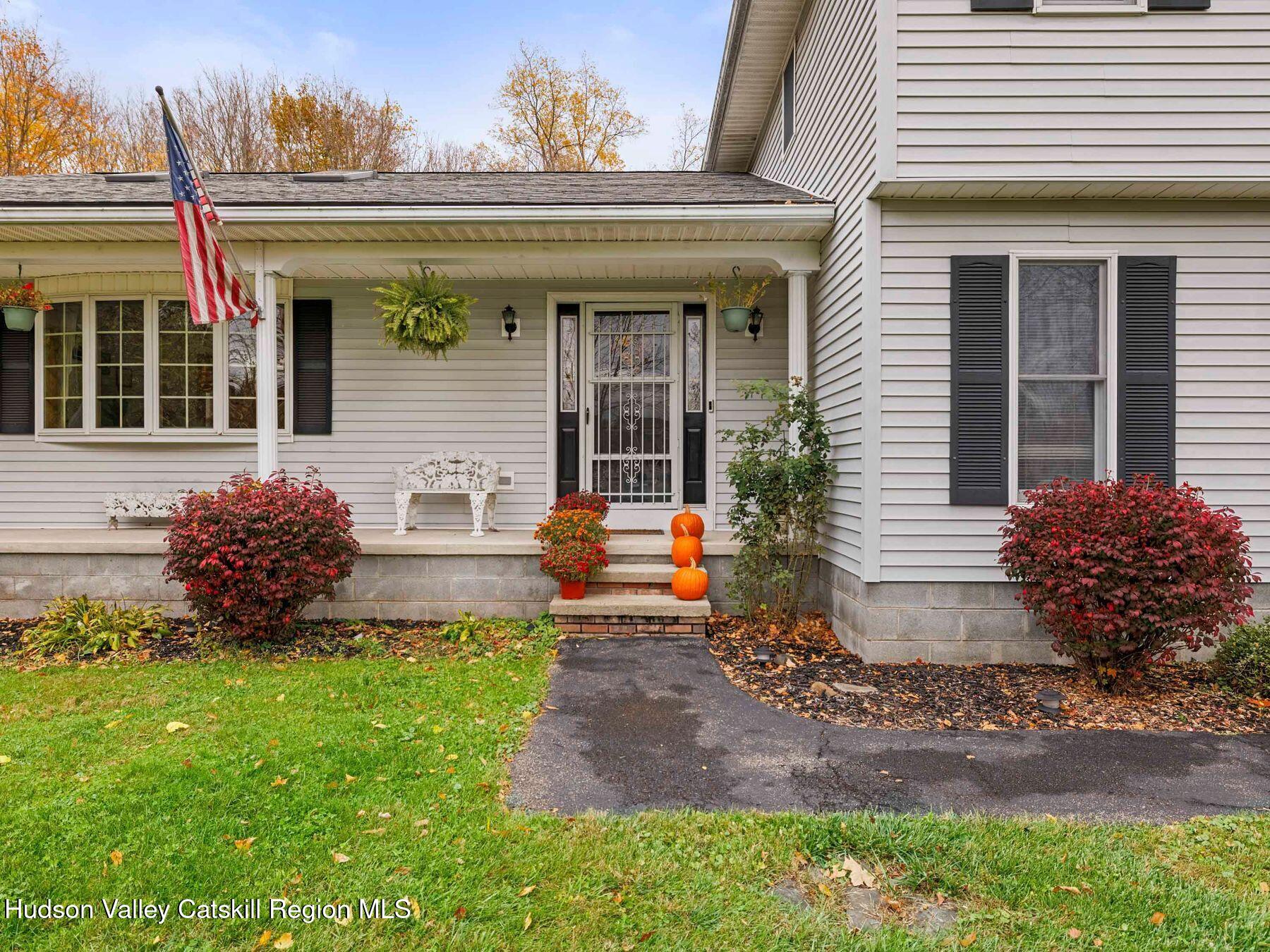 15 Ruby Meadows Road Lake Katrine, NY 12449 - Photo 47 of 53 a view of a house with potted plants and a yard