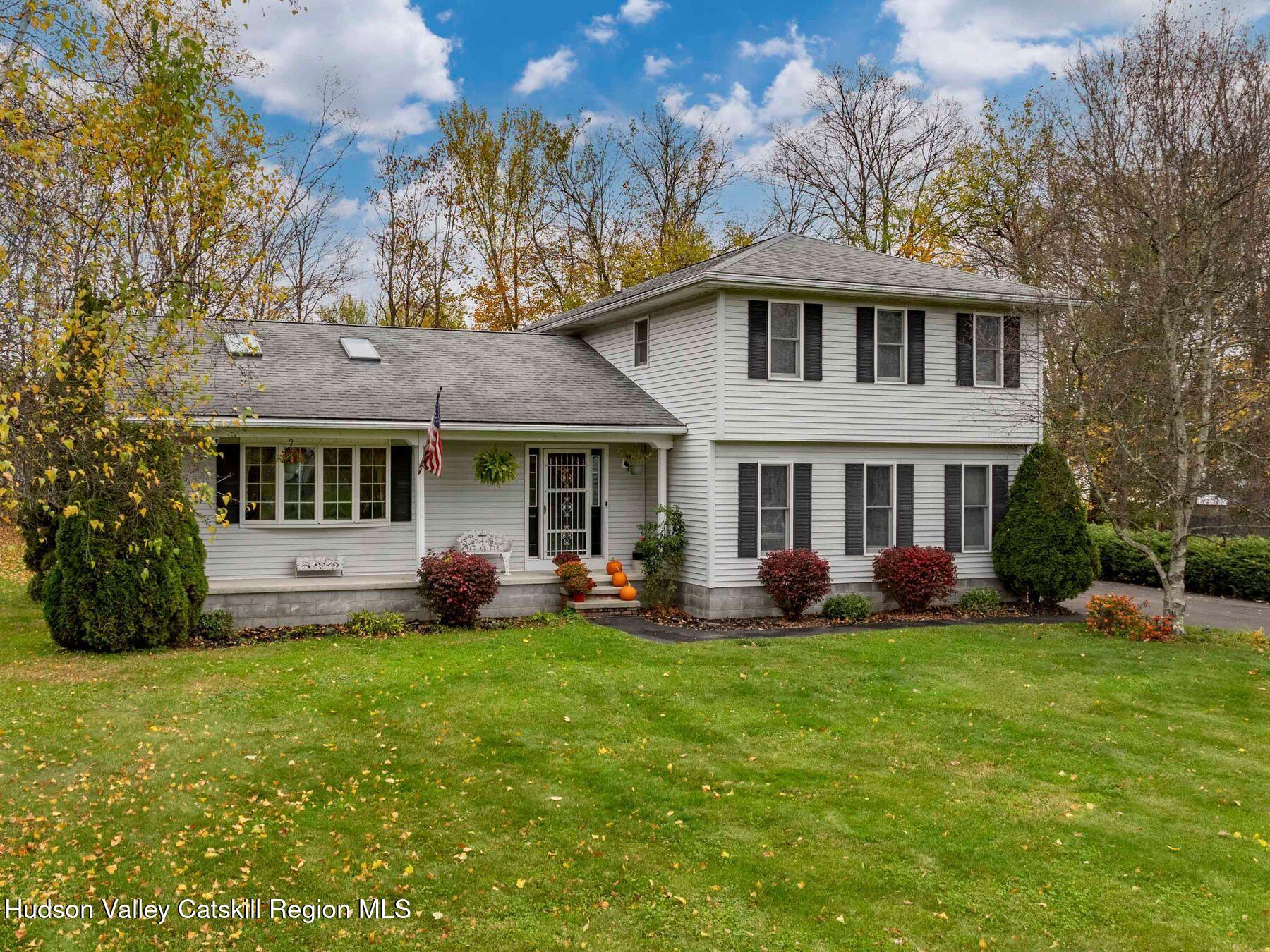 15 Ruby Meadows Road Lake Katrine, NY 12449 - Photo 53 of 53 a front view of a house with a garden and trees