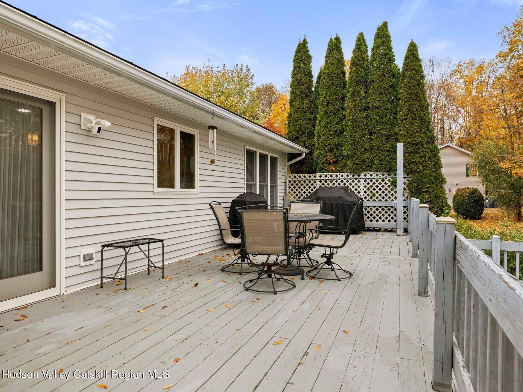 15 Ruby Meadows Road Lake Katrine, NY 12449 - Photo 9 of 53 a view of a deck with table and chairs and wooden floor