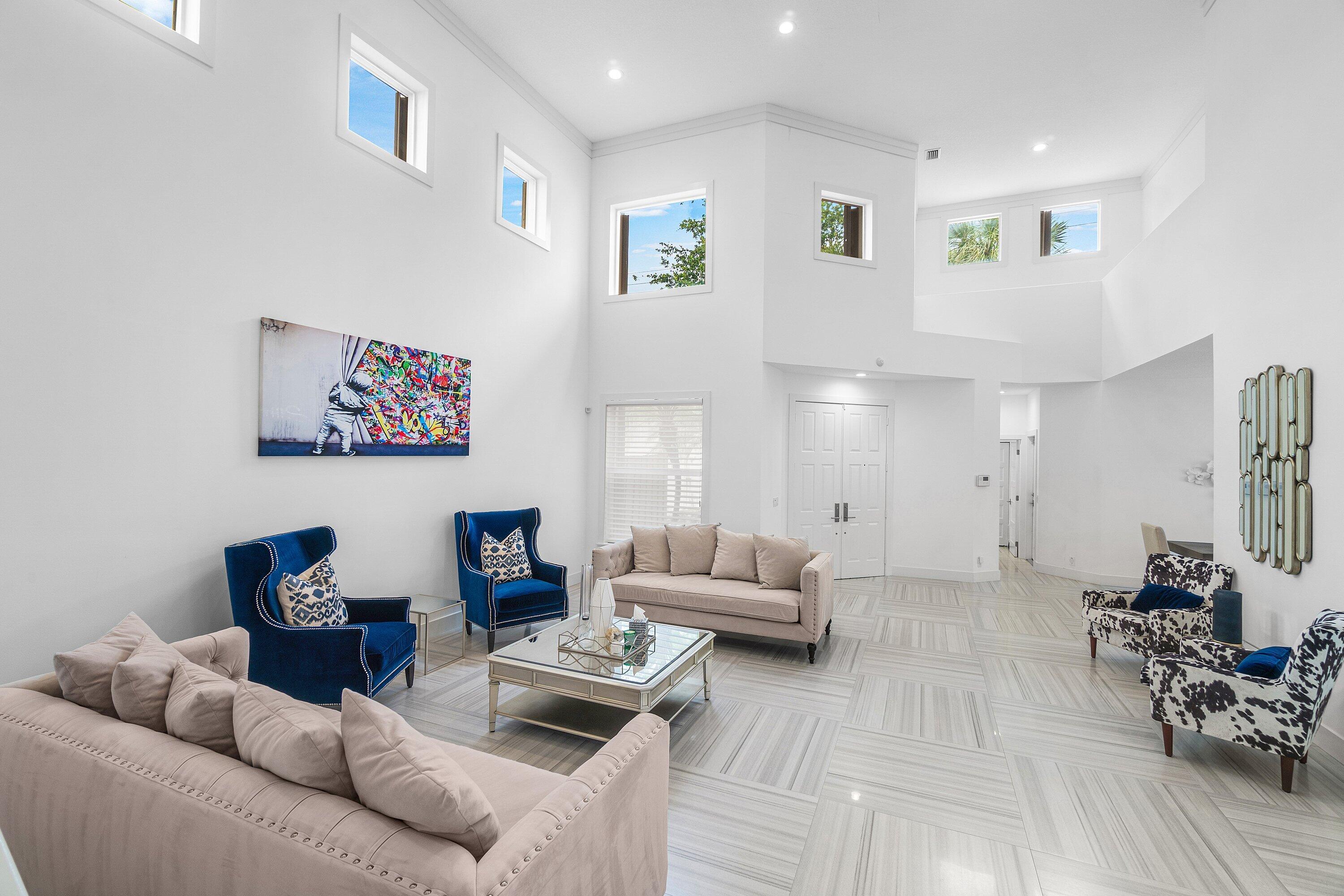 2404 Northwest 67th Street Boca Raton, FL 33496 - Photo 6 of 74 a living room with furniture and wooden floor