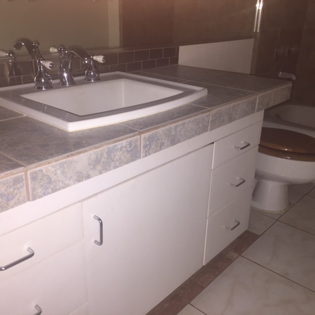 3559 Lower Honoapiilani Road, Unit 718 Lahaina, HI 96761 - Photo 15 of 23 a bathroom with a sink and a mirror