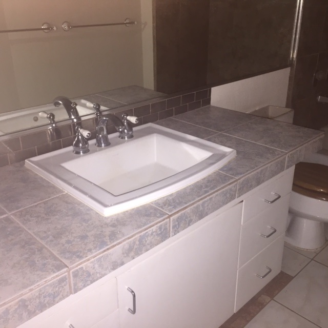 3559 Lower Honoapiilani Road, Unit 718 Lahaina, HI 96761 - Photo 16 of 23 a bathroom with a sink and a mirror