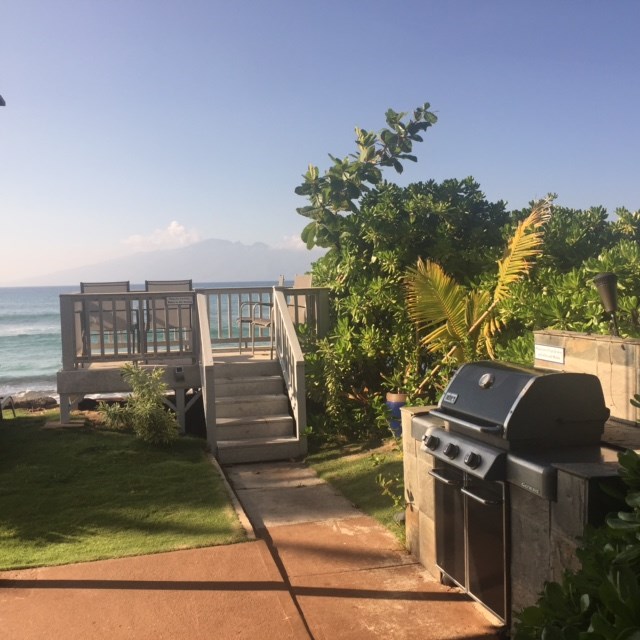 3559 Lower Honoapiilani Road, Unit 718 Lahaina, HI 96761 - Photo 20 of 23 a front view of a house with a yard