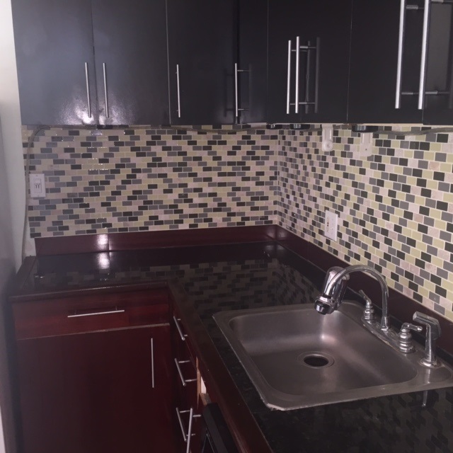 3559 Lower Honoapiilani Road, Unit 718 Lahaina, HI 96761 - Photo 3 of 23 a bathroom with a sink and a mirror
