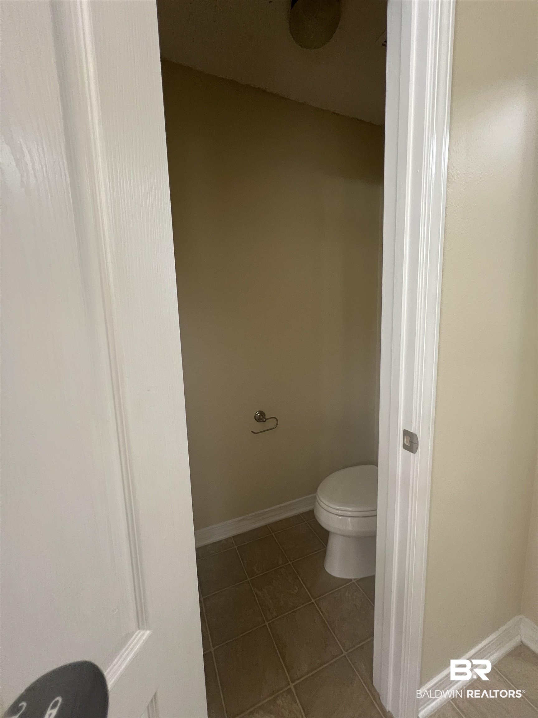 17793 Fancy Boulevard Foley, AL 36535 - Photo 19 of 34 Bathroom with tile patterned floors and toilet