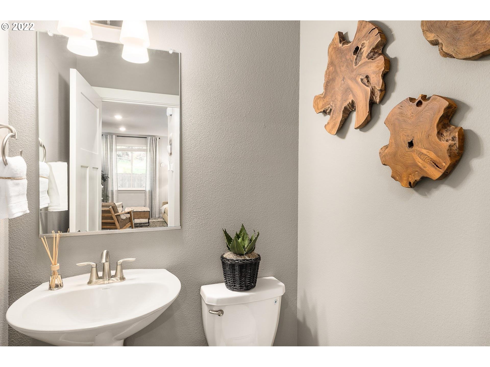 2408 South Brookside Place Ridgefield, WA 98642 - Photo 22 of 32 a bathroom with a sink and a mirror