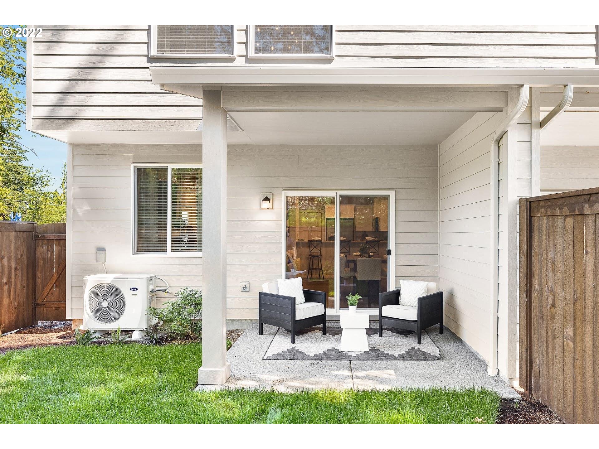 2408 South Brookside Place Ridgefield, WA 98642 - Photo 27 of 32 a view of backyard with a patio and outdoor seating