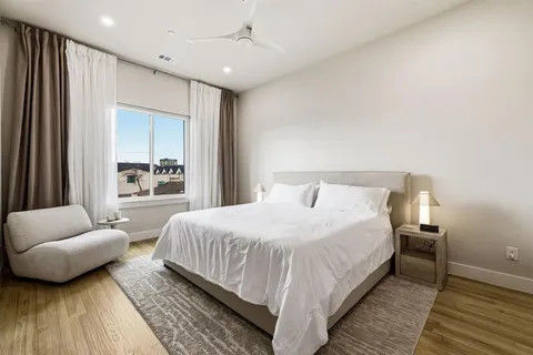 a bedroom with bed and a couch