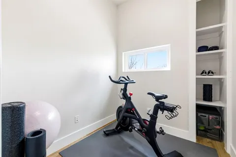 a view of a livingroom with furniture and a window