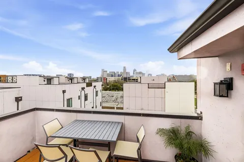 a view of a terrace with furniture and stove
