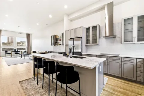 a kitchen with a stove a sink and a refrigerator
