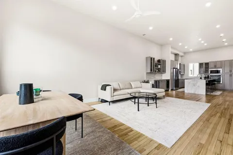 a living room with furniture and a table