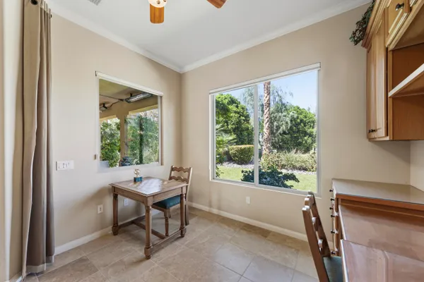 a reading room with furniture and a window