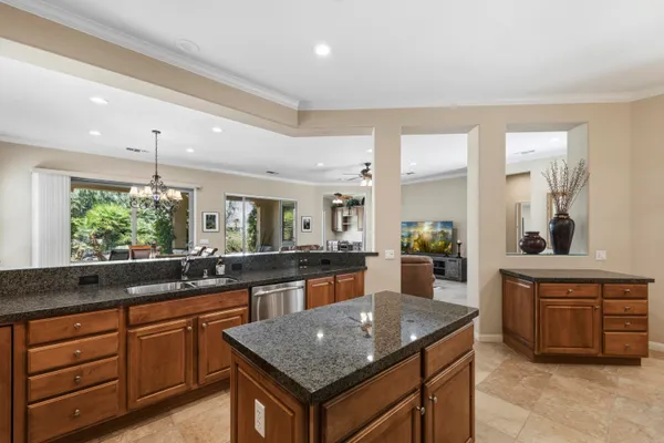 a kitchen with a stove a sink and a refrigerator