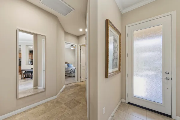 a view of a bathroom from a hallway