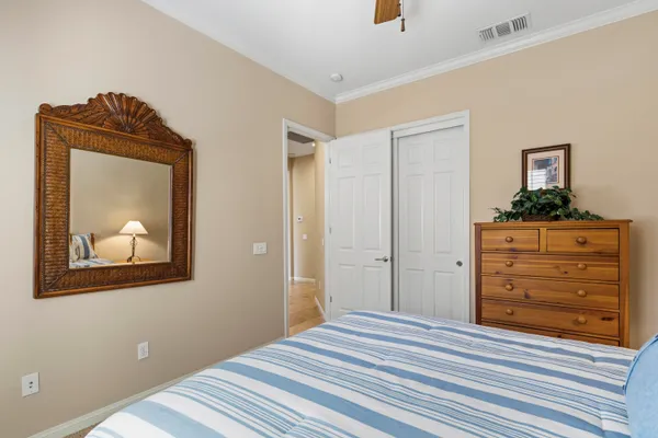 a bedroom with a bed and a dresser