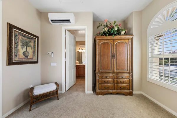 a bathroom with a sink vanity mirror and toilet