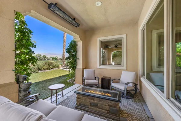 a view of a patio in the backyard