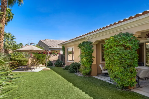 a view of a bench in front of a house