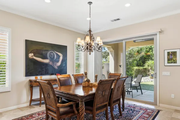 a view of a dining room with furniture window and outside view