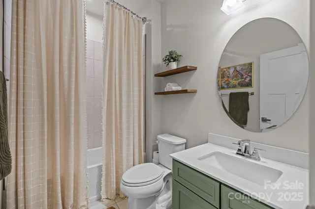 a view of a patio with couches table and chairs and potted plants