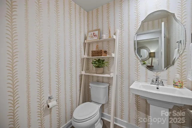 a large kitchen with a table and chairs