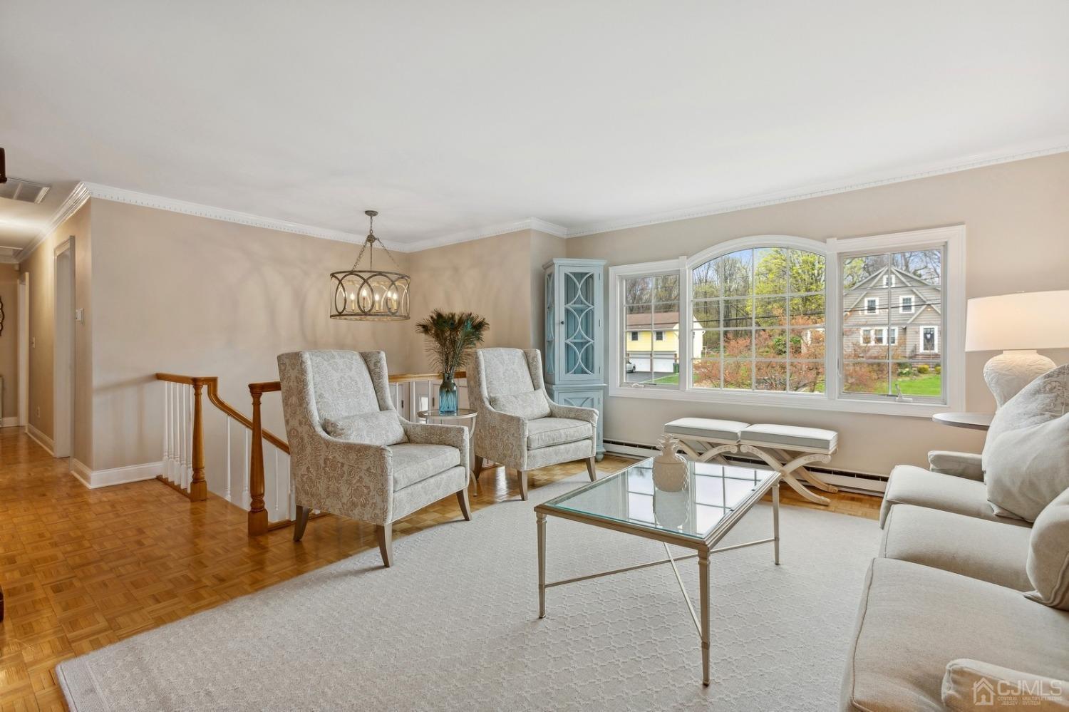 33 King Street Edison, NJ 08820 - Photo 11 of 44 a living room with furniture and a table