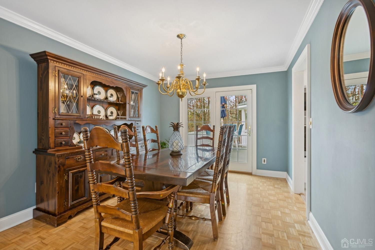 33 King Street Edison, NJ 08820 - Photo 14 of 44 a view of a dining room with furniture and a chandelier