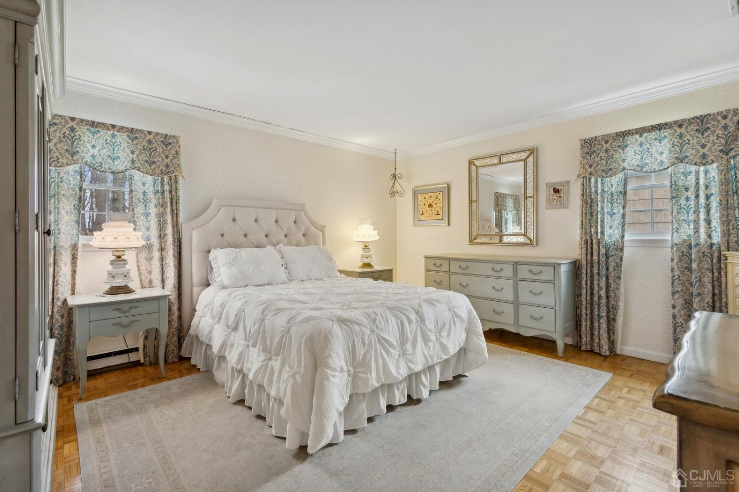 33 King Street Edison, NJ 08820 - Photo 17 of 44 a spacious bedroom with a bed and a cabinets