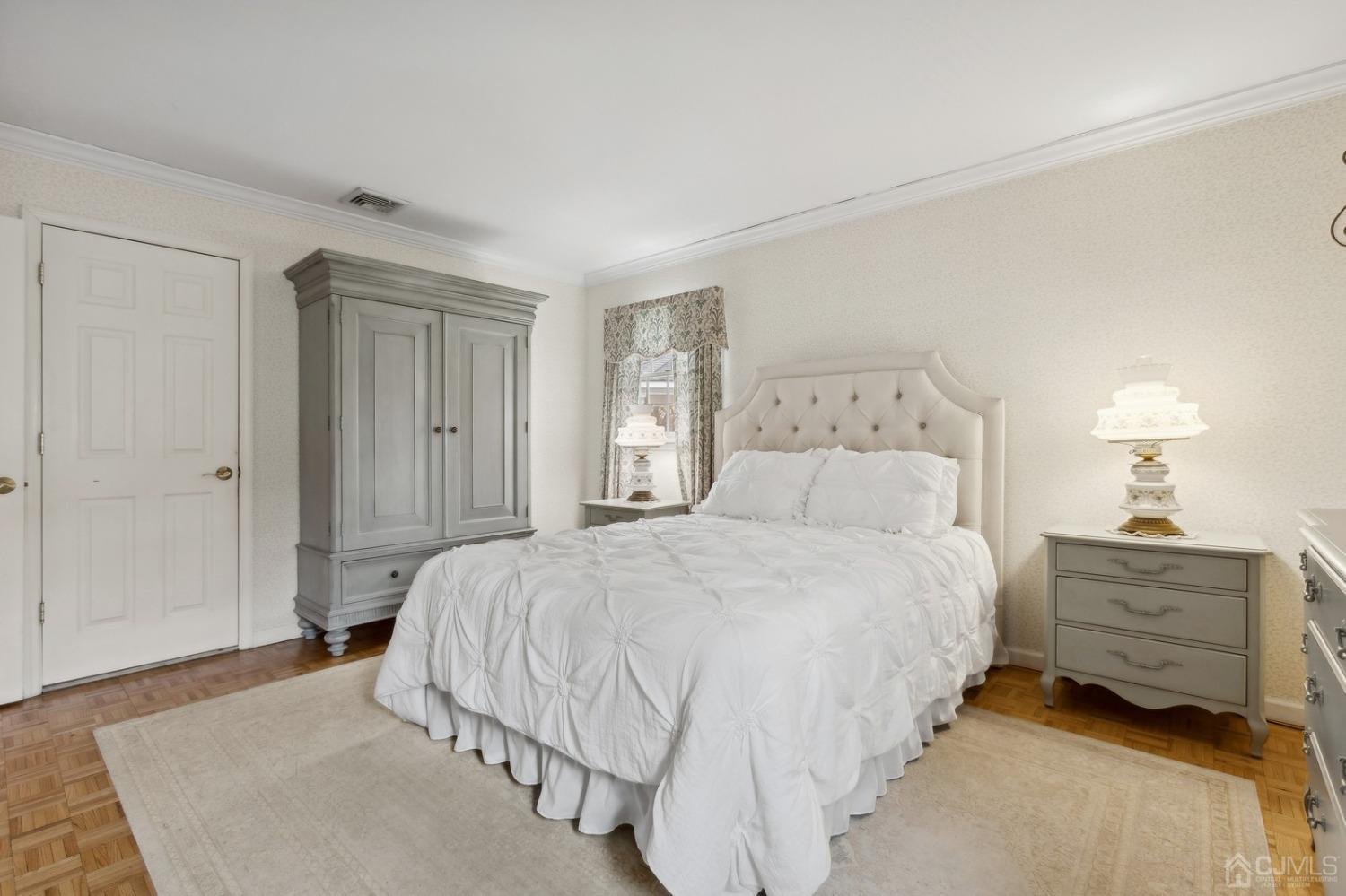 33 King Street Edison, NJ 08820 - Photo 18 of 44 a bedroom with a bed and a lamp