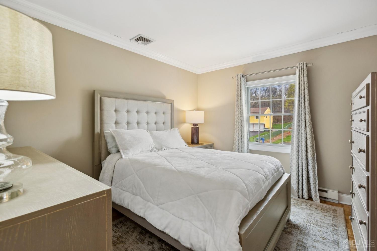 33 King Street Edison, NJ 08820 - Photo 19 of 44 a bedroom with a bed and a window