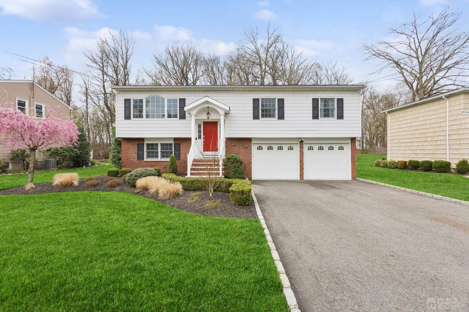 33 King Street Edison, NJ 08820 - Photo 2 of 44 a front view of a house with a yard and garage