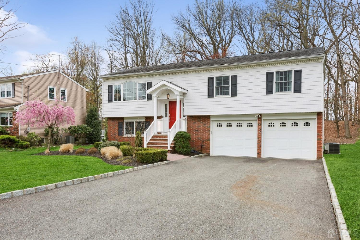 33 King Street Edison, NJ 08820 - Photo 3 of 44 a view of a house with a yard and garage
